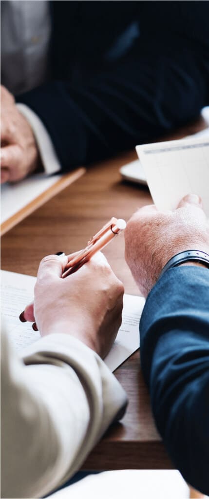 Man and woman review financial documents.